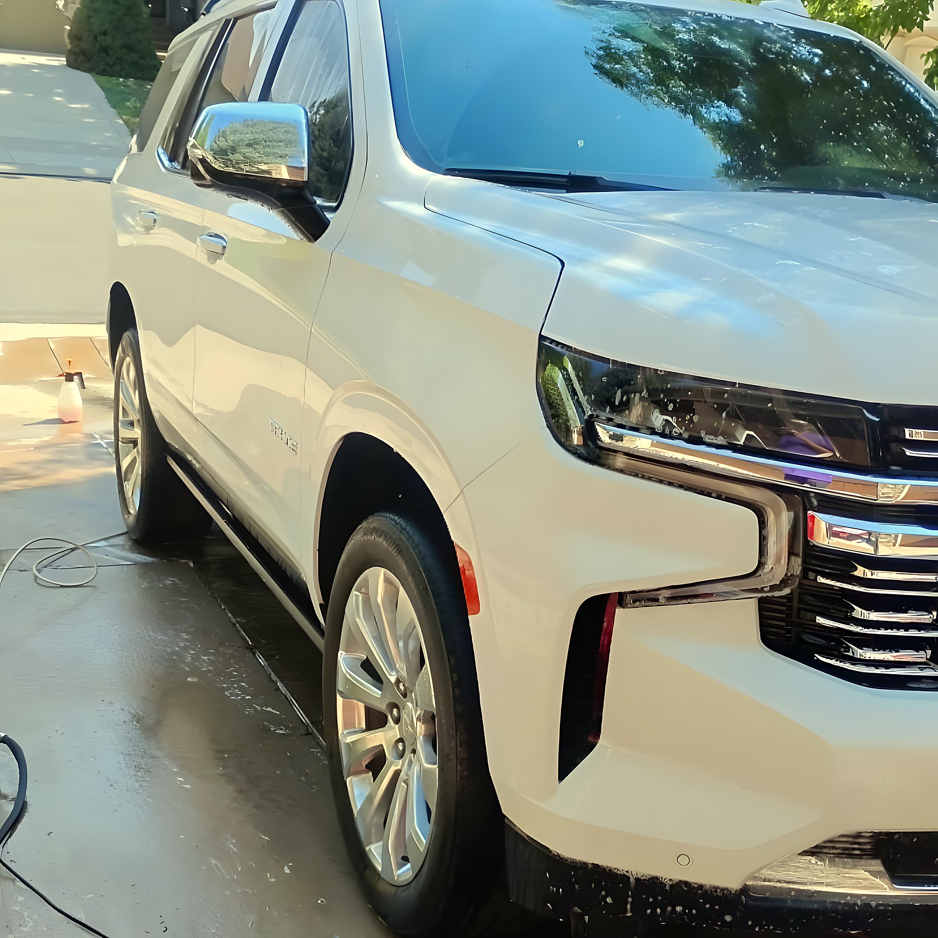 White Cadillac Escalade after an exterior wash and detail in the Denver Metro