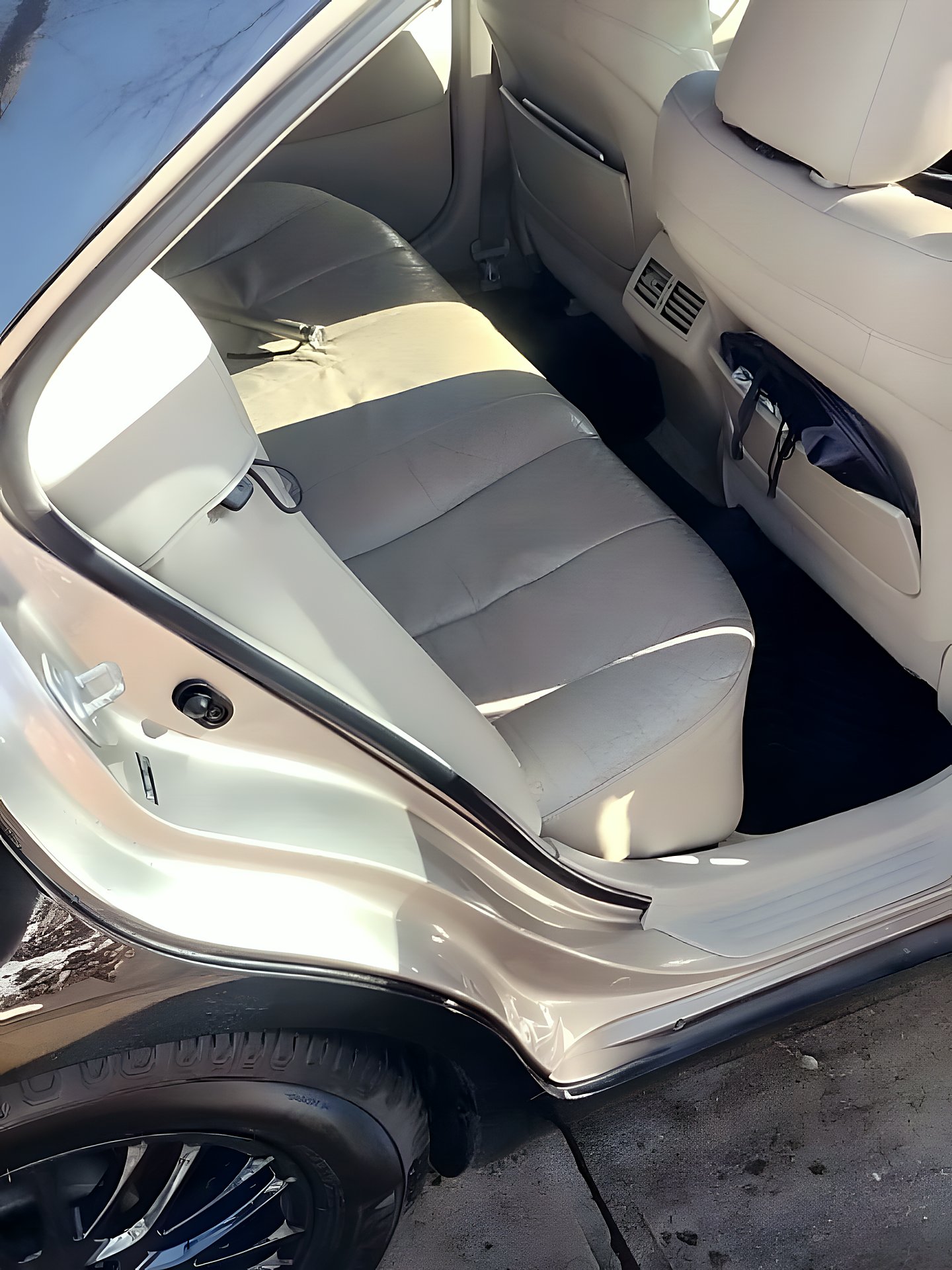 Beige leather rear bench seats cleaned and conditioned