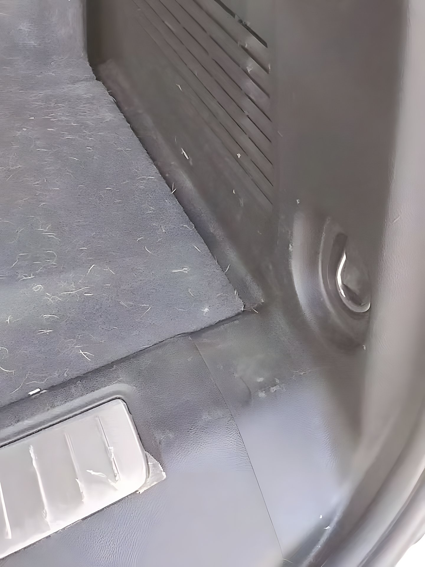 Before: cargo-area carpet with debris ahead of a deep vacuum