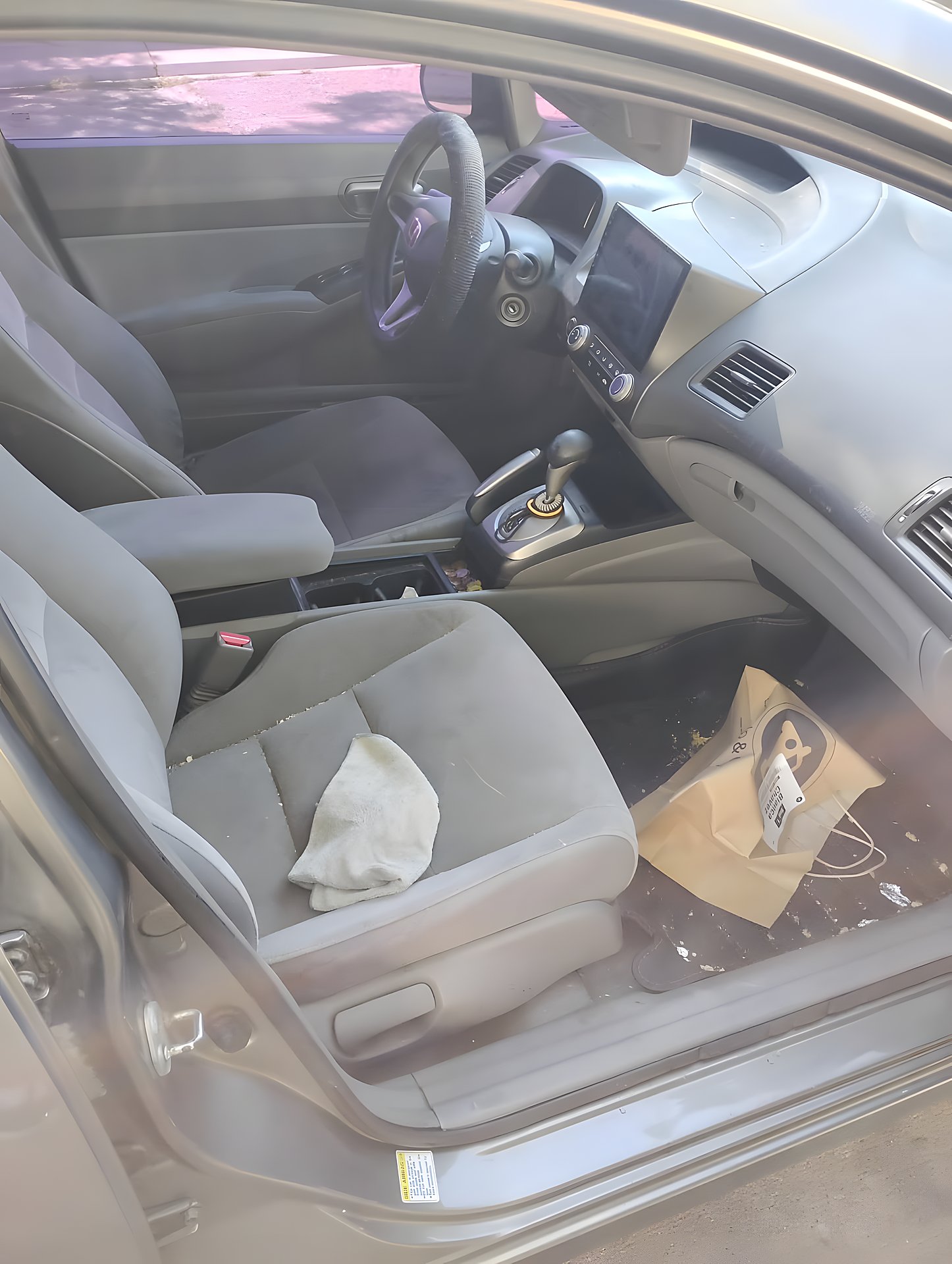 Before: cloth seats and dashboard with debris, ready for a deep interior detail